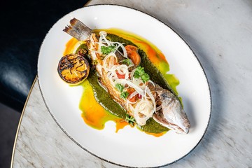 Whole fish cooked on a dish