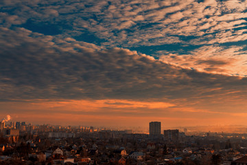 Fototapeta na wymiar Beautiful sky with clouds over the city at sunset
