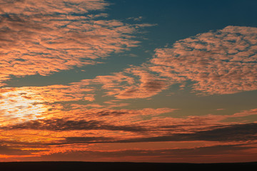 Beautiful sky with clouds over the city at sunset