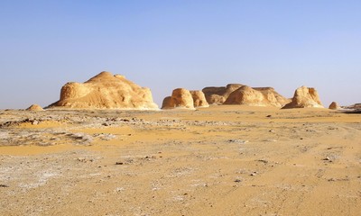 Fototapeta na wymiar Natural rock formation in the white desert in the west of Egypt in daytime