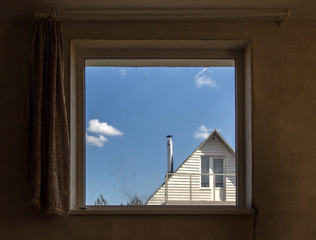 window blue sky and house