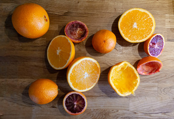 Fototapeta na wymiar oranges and lemons on wooden table