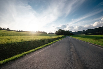 Road in mountain valley at sunny morning in Poland.