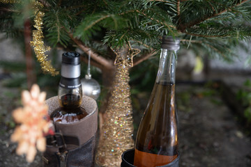 Christmas tree with a bottle of whisky in a shoe