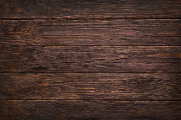 Wooden dark brown retro shabby planks wall ,table or floor texture banner background.Wood desk photo mockup wallpaper design for decoration .