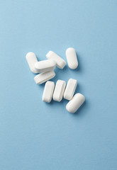 BCAA amino acids. Nutrition for bodybuilding. Fitness supplements on bright paper background. Top view. Copy space. 