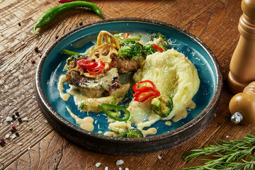 Close up view on fresh pan-fried seabass served with potato and tomato cherry in white plate. Food photo for menu or recipe. Selective focus. Healthy seafood for lunch sea bass