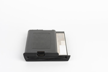 Floppy disk drive from 16 year old laptop on white background