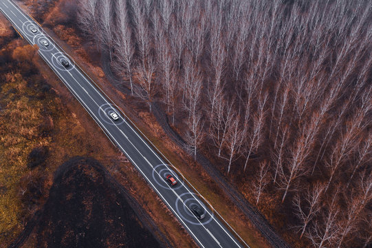 Aerial view of autonomous self-driving car on road