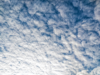 Many white clouds on blue sky background