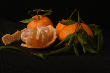 Mandarin fruit on a black background
