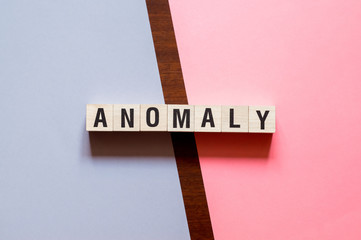Anomaly word concept on cubes