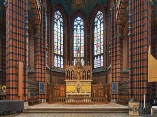 Choir and altar of St. John's Church in Stockholm, Sweden. The brick church in the Neo-Gothic style...