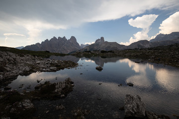 Fototapeta na wymiar Dolomites mountains in Italy reflection in lake clouds