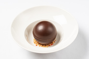 round chocolate dessert  with nuts