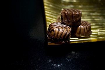 Various of sweet confectionery with chocolate candies and pralines. Handmade chocolates. Realistic chocolate set, delicious dessert pattern.