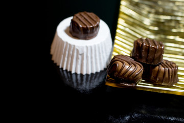 Various of sweet confectionery with chocolate candies and pralines. Handmade chocolates. Realistic chocolate set, delicious dessert pattern.