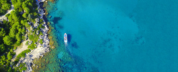 Aerial drone ultra wide photo of famous paradise rocky bay and beach of Anthony Quinn in Rodos island, Dodecanese, Greece