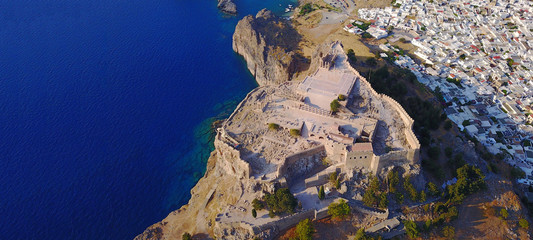 Aerial drone ultra wide photo of famous castle and village of Lindos, Rodos island, Dodecanese,...