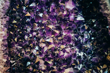 Section of a natural amethyst kimberlite pipe. Purple amethyst crystals, close-up. Exhibit of the...