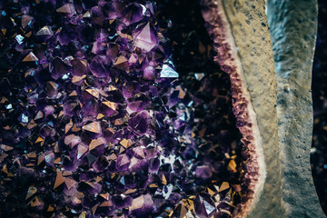 Section of a natural amethyst kimberlite pipe. Purple amethyst crystals, close-up. Exhibit of the...