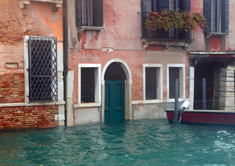 Venetian houses in Venice on the Grand Canal with  flooded gates