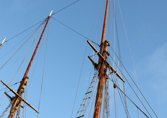 The mast of the yard of a sea Sailer in the Harbor