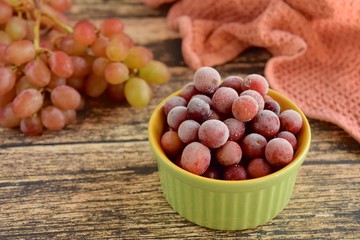 Frozen grapes on ramekin. Selective focus