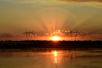High voltage power line at sunset, Pampas, Argentina
