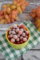 Frozen grapes on ramekin. Selective focus