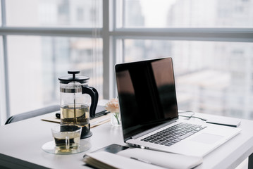 Working on laptop at table