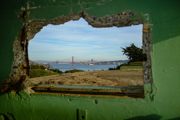 Artistic View of Golden Gate Bridge through a window of Fort Barry, Marin, California