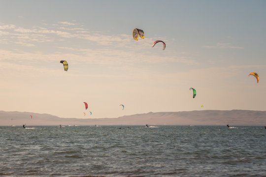 A lot of kitesurfers in Paracas, Peru.