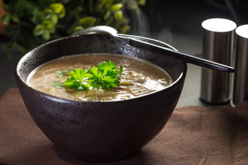 Hot mushroom soup with noodles. Small depth of field.