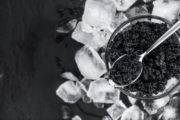 Slate slab with Black Caviar (selective focus; close-up shot)