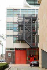 Industrial building with stairs and driving car