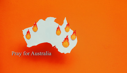 burning map of Australia on a orange background - Australia bushes wildfires
