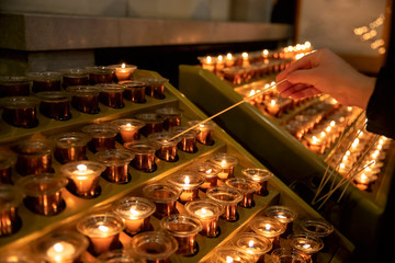 Candles in the Catholic Church on a candlestick