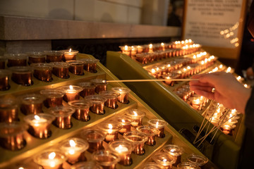 Candles in the Catholic Church on a candlestick