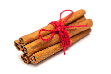 ingredients for making mulled wine cinnamon on a white background