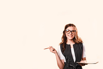 Business woman brunette in glasses. With folder and notebook for writing. business style. Vivid emotions, surprise and act and decision making.Business concept