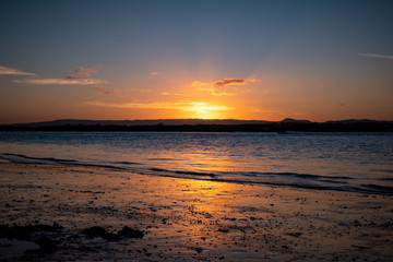 Naklejka na ściany i meble Beautiful evening sunset at Stradbroke Island overlooking the ocean and shoreline