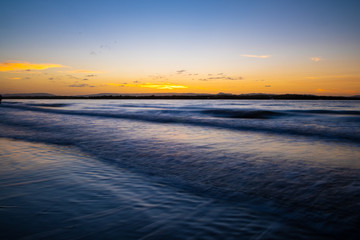 Fototapeta na wymiar Beautiful evening sunset at Stradbroke Island overlooking the ocean and shoreline