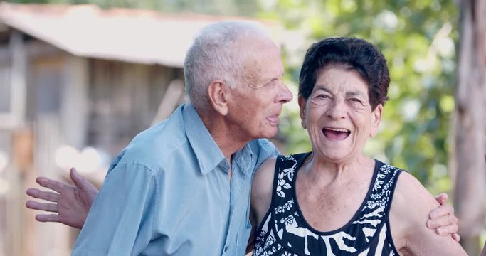Old man in love kissing his wife. 4K Red Camera footage.