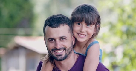 Brazilian little girl sitting on her fathers shoulders. 4K. - Powered by Adobe