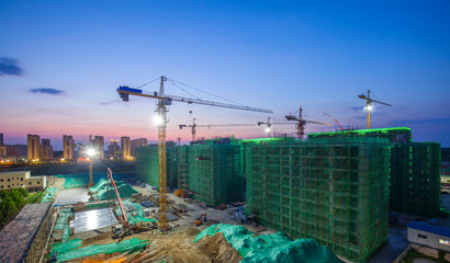 Tower cranes at night