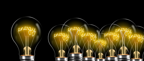 the word energy sparkles in the bulb on dark. electric power concept