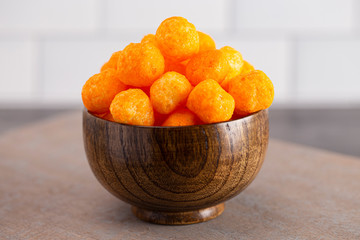Cheese Covered Ball Snacks in a Bowl on the Counter