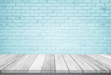 Empty wooden table top isolated on blue brick white background, Design Wood terrace white. Free space for your copy and branding. Can be used as product display montage. Vintage style concept.