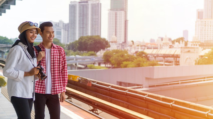 Obraz premium Travel Concept, Muslim Tourist Couple at Kuala Lumpur